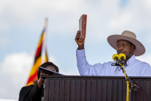 President Museveni swearing in on Tuesday, May 12, with a bible 